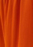 نساء البرتقالي بنطال بخصر مرتفع وتفاصيل من الفتحات على الساقين